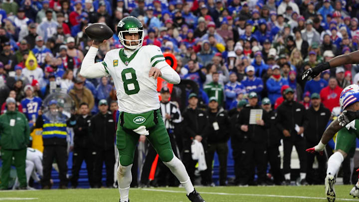 New York Jets quarterback Aaron Rodgers (8) throws the ball against the Buffalo Bills during the first half at Highmark Stadium. 