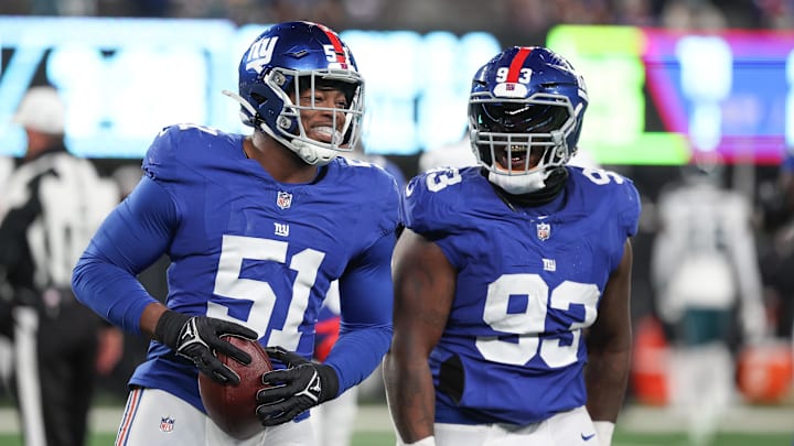 Jan 7, 2024; East Rutherford, New Jersey, USA; New York Giants linebacker Azeez Ojulari (51) celebrates with defensive tackle Rakeem Nunez-Roches (93) after recovering a fumble during the second half against the Philadelphia Eagles at MetLife Stadium.