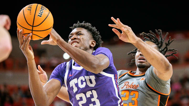 TCU center Vianney Salatchoum rebounds against Oklahoma State.