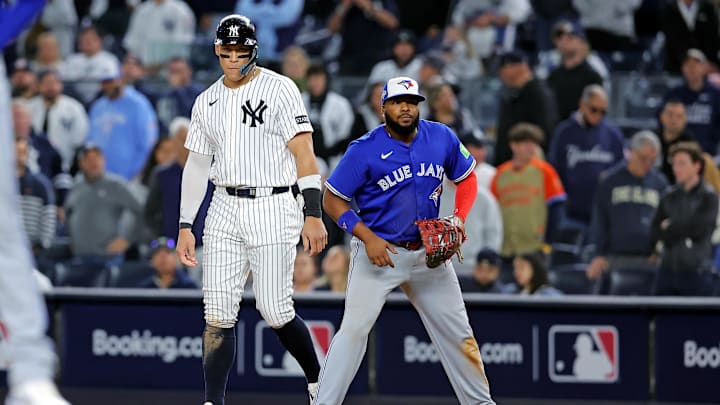 Oct 8, 2025; Bronx, New York, USA; New York Yankees right fielder Aaron Judge (99) stands on first base with Toronto Blue Jays first baseman Vladimir Guerrero Jr. (27) during the ninth inning during game four of the ALDS round for the 2025 MLB playoffs at Yankee Stadium. Mandatory Credit: Brad Penner-Imagn Images Oct 8, 2025; Bronx, New York, USA; New York Yankees right fielder Aaron Judge (99) stands on first base with Toronto Blue Jays first baseman Vladimir Guerrero Jr. (27) during the ninth inning during game four of the ALDS round for the 2025 MLB playoffs at Yankee Stadium. Mandatory Credit: Brad Penner-Imagn Images