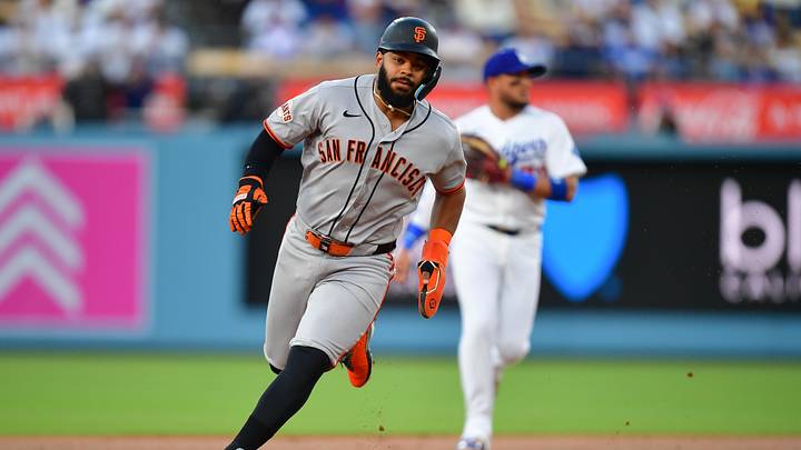 May 13, 2026; Los Angeles, California, USA; San Francisco Giants left fielder Heliot Ramos (17) runs to third base in the first inning against the Los Angeles Dodgers at Dodger Stadium. Mandatory Credit: Gary A. Vasquez-Imagn Images