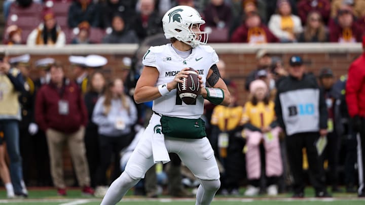 Nov 1, 2025; Minneapolis, Minnesota, USA; Michigan State Spartans quarterback Alessio Milivojevic (11) looks to pass against the Minnesota Golden Gophers during the first half at Huntington Bank Stadium. Mandatory Credit: Matt Krohn-Imagn Images