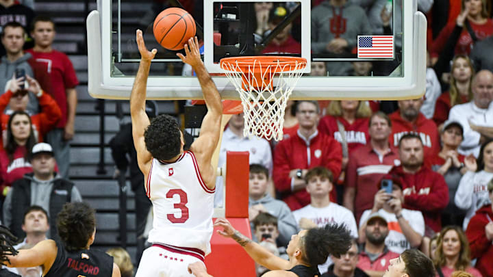 Dec 29, 2024; Bloomington, Indiana, USA;  Indiana Hoosiers guard Anthony Leal (3) scores past Winthrop Eagles guard Paul Jones III (3) during the second half at Simon Skjodt Assembly Hall. Mandatory Credit: Robert Goddin-Imagn Images