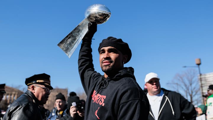 Feb 14, 2025; Philadelphia, PA, USA; Philadelphia Eagles quarterback Jalen Hurts (1) raises the Lombardi Trophy during the Super Bowl LIX championship parade and rally. Mandatory Credit: Caean Couto-Imagn Images Feb 14, 2025; Philadelphia, PA, USA; Philadelphia Eagles quarterback Jalen Hurts (1) raises the Lombardi Trophy during the Super Bowl LIX championship parade and rally. Mandatory Credit: Caean Couto-Imagn Images