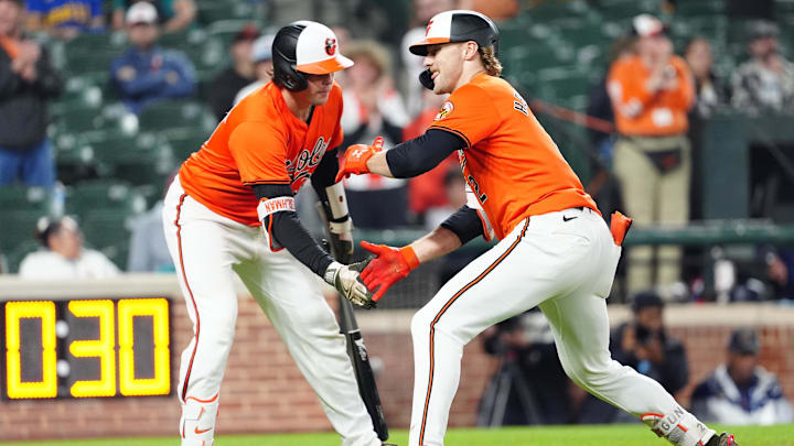 May 18, 2024; Baltimore, Maryland, USA; Baltimore Orioles catcher Adley Rutschman (35) congratulates shortstop Gunnar Henderson (2) for hitting a home run during the ninth inning against the Seattle Mariners at Oriole Park at Camden Yards. May 18, 2024; Baltimore, Maryland, USA; Baltimore Orioles catcher Adley Rutschman (35) congratulates shortstop Gunnar Henderson (2) for hitting a home run during the ninth inning against the Seattle Mariners at Oriole Park at Camden Yards.