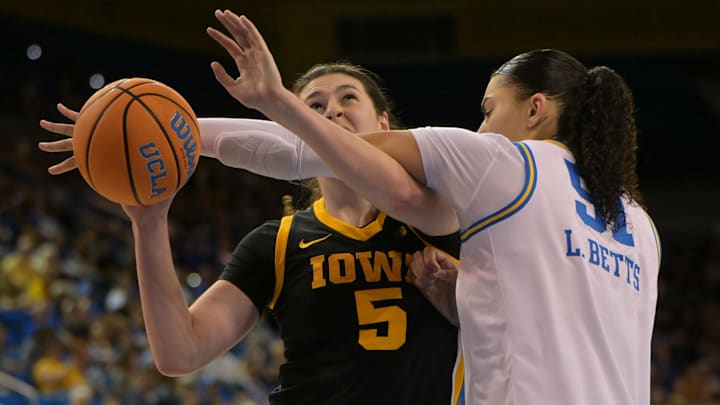 Feb 1, 2026; Los Angeles, California, USA; Iowa Hawkeyes guard Ava Heiden (5) is fouled by UCLA Bruins center Lauren Betts (51) in the second half at Pauley Pavilion presented by Wescom Financial. Mandatory Credit: Jayne Kamin-Oncea-Imagn Images Feb 1, 2026; Los Angeles, California, USA; Iowa Hawkeyes guard Ava Heiden (5) is fouled by UCLA Bruins center Lauren Betts (51) in the second half at Pauley Pavilion presented by Wescom Financial. Mandatory Credit: Jayne Kamin-Oncea-Imagn Images
