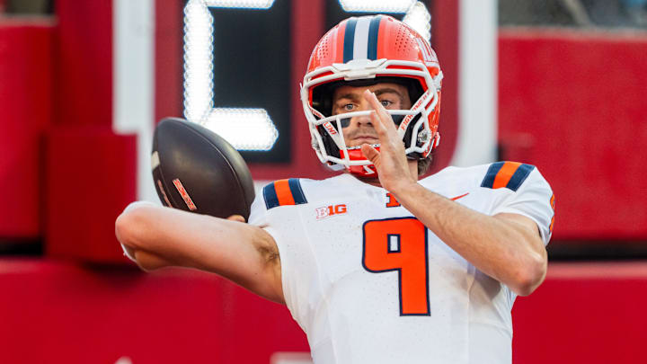 Sep 20, 2024; Lincoln, Nebraska, USA; Illinois Fighting Illini quarterback Luke Altmyer (9) warms up before a game against the Nebraska Cornhuskers at Memorial Stadium. Mandatory Credit: Dylan Widger-Imagn Images