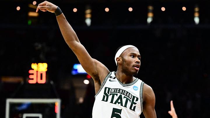 Mar 23, 2025; Cleveland, OH, USA; Michigan State Spartans guard Tre Holloman (5) reacts in the second half against the New Mexico Lobos during the NCAA Tournament Second Round at Rocket Arena. Mandatory Credit: Ken Blaze-Imagn Images Mar 23, 2025; Cleveland, OH, USA; Michigan State Spartans guard Tre Holloman (5) reacts in the second half against the New Mexico Lobos during the NCAA Tournament Second Round at Rocket Arena. Mandatory Credit: Ken Blaze-Imagn Images