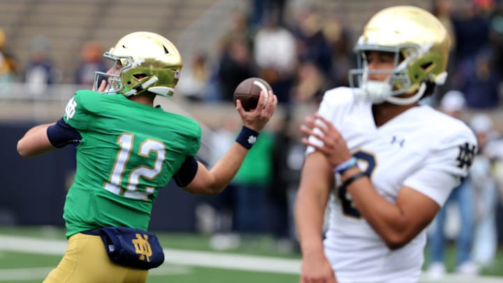 Notre Dame quarterbacks CJ Carr (12) and Kenny Minchey (8) warm up Saturday, April 20, 2024, at the annual Notre Dame Blue-Gold spring football game at Notre Dame Stadium in South Bend.