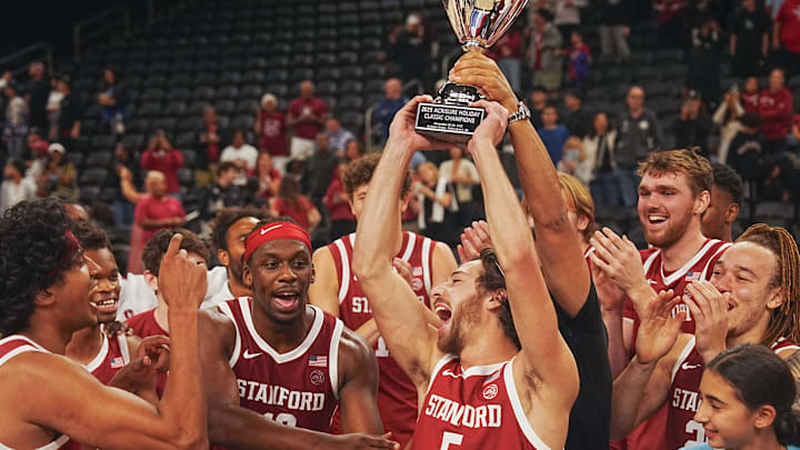 Benny Gealer raises the trophy after making a three-pointer with .08 seconds left to give Stanford the win over St. Louis University in the Acrisure Invitational Champioship game at Acrisure Arena in Palm Desert, Calif., Nov. 28, 2025.