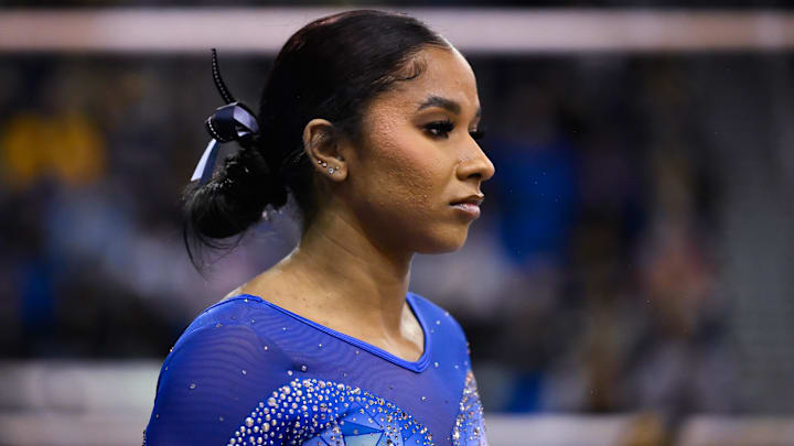 Feb 14, 2025; Los Angeles, CA, USA; UCLA gymnast Jordan Chiles prepares to compete on the uneven bars during an NCAA gymnastics meet against Penn State at Pauley Pavilion presented by Wesco.