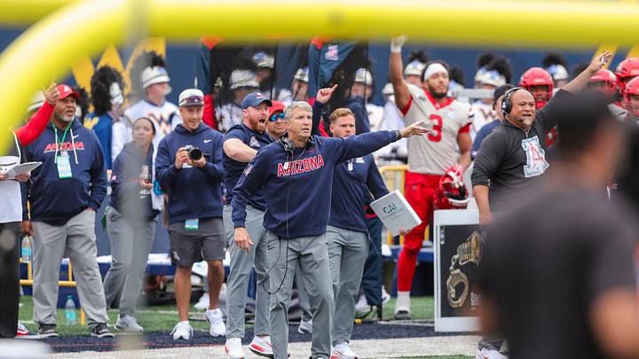 Oct 10, 2026; Morgantown, West Virginia, USA; Arizona Wildcats head coach Brent Brennan signals another direction after a turnover during the second quarter against the West Virginia Mountaineers at Milan Puskar Stadium. Oct 10, 2026; Morgantown, West Virginia, USA; Arizona Wildcats head coach Brent Brennan signals another direction after a turnover during the second quarter against the West Virginia Mountaineers at Milan Puskar Stadium.
