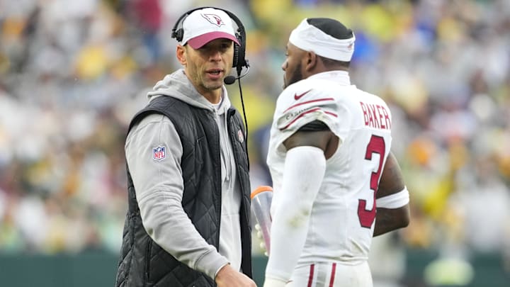 Oct 13, 2024; Green Bay, Wisconsin, USA;  Arizona Cardinals head coach Jonathan Gannon talks with safety Budda Baker (3) during the first quarter against the Green Bay Packers at Lambeau Field. Mandatory Credit: Jeff Hanisch-Imagn Images
