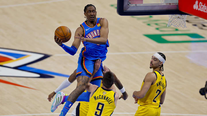 Jun 8, 2025; Oklahoma City, Oklahoma, USA; Oklahoma City Thunder forward Jalen Williams (8) drives to the basket past Indiana Pacers guard T.J. McConnell (9) and guard Andrew Nembhard (2) during the second quarter of game two of the 2025 NBA Finals at Paycom Center. Mandatory Credit: Alonzo Adams-Imagn Images