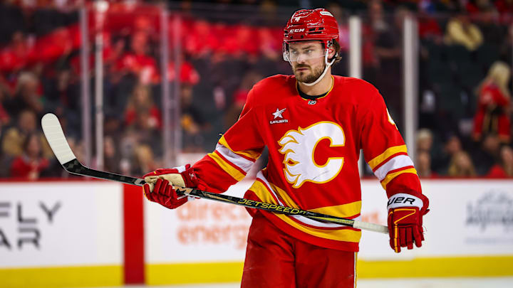 Apr 11, 2025; Calgary, Alberta, CAN; Calgary Flames defenseman Rasmus Andersson (4) against the Minnesota Wild during the second period at Scotiabank Saddledome. Mandatory Credit: Sergei Belski-Imagn Images