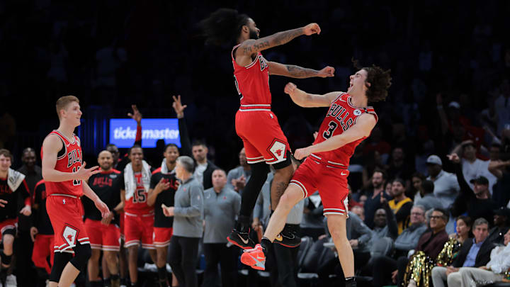 Mar 8, 2025; Miami, Florida, USA; Chicago Bulls guard Josh Giddey (3) celebrates with guard Coby White (0) after scoring against the Miami Heat during the fourth quarter at Kaseya Center. Mandatory Credit: Sam Navarro-Imagn Images