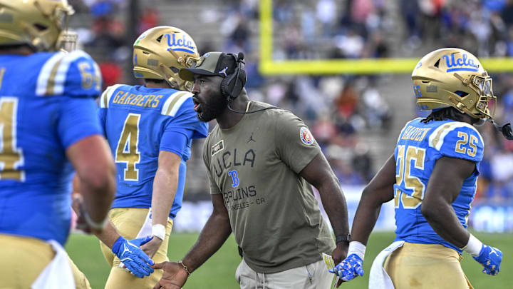 Nov 30, 2024; Pasadena, California, USA; UCLA Bruins head coach DeShaun Foster greets his players after a Bruins touchdown against the Fresno State Bulldogs in the third quarter at Rose Bowl. Mandatory Credit: Robert Hanashiro-Imagn Images