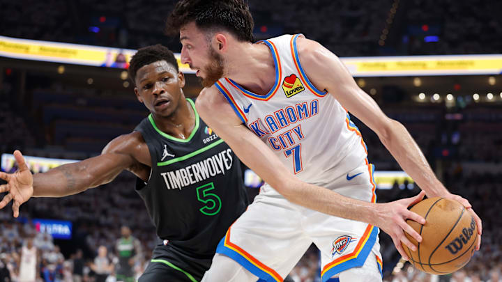 Oklahoma City Thunder forward Chet Holmgren controls the ball against Minnesota Timberwolves guard Anthony Edwards in the second quarter during Game 1 of the Western Conference finals at Paycom Center in Oklahoma City on May 20, 2025. 