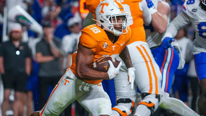 Oct 12, 2024; Knoxville, Tennessee, USA; Tennessee Volunteers running back DeSean Bishop (18) runs with the ball against the Florida Gators  during a game at Neyland Stadium. Mandatory Credit: Angelina Alcantar/USA TODAY Network via Imagn Images