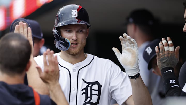 Jun 26, 2025; Detroit, Michigan, USA;  Detroit Tigers outfielder Parker Meadows (22) receives congratulations from teammates after scoring in the third inning against the Athletics at Comerica Park. Mandatory Credit: Rick Osentoski-Imagn Images
