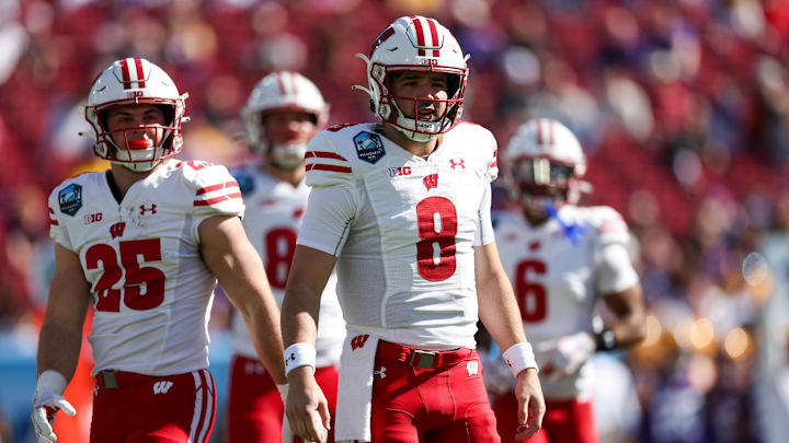 Jan 1, 2024; Tampa, FL, USA;  Wisconsin Badgers quarterback Tanner Mordecai (8) waits for a play.