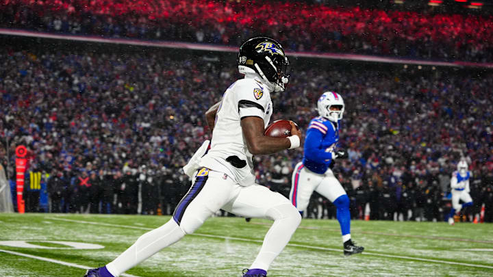 Jan 19, 2025; Orchard Park, New York, USA; Baltimore Ravens quarterback Lamar Jackson (8) runs the ball during the fourth quarter against the Buffalo Bills in a 2025 AFC divisional round game at Highmark Stadium. Mandatory Credit: Gregory Fisher-Imagn Images