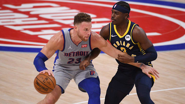 Feb 11, 2021; Detroit, Michigan, USA; Detroit Pistons forward Blake Griffin (23) looks to pass the ball as Indiana Pacers guard Aaron Holiday (3) defends during the second quarter at Little Caesars Arena. Mandatory Credit: Tim Fuller-Imagn Images