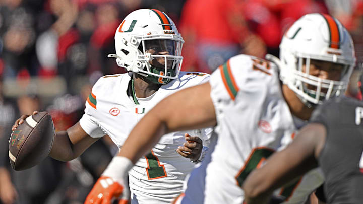 Oct 19, 2024; Louisville, Kentucky, USA; Miami Hurricanes quarterback Cam Ward (1) looks to pass against the Louisville Cardinals during the first half at L&N Federal Credit Union Stadium. Miami defeated Louisville 52-45. Mandatory Credit: Jamie Rhodes-Imagn Images Oct 19, 2024; Louisville, Kentucky, USA; Miami Hurricanes quarterback Cam Ward (1) looks to pass against the Louisville Cardinals during the first half at L&N Federal Credit Union Stadium. Miami defeated Louisville 52-45. Mandatory Credit: Jamie Rhodes-Imagn Images