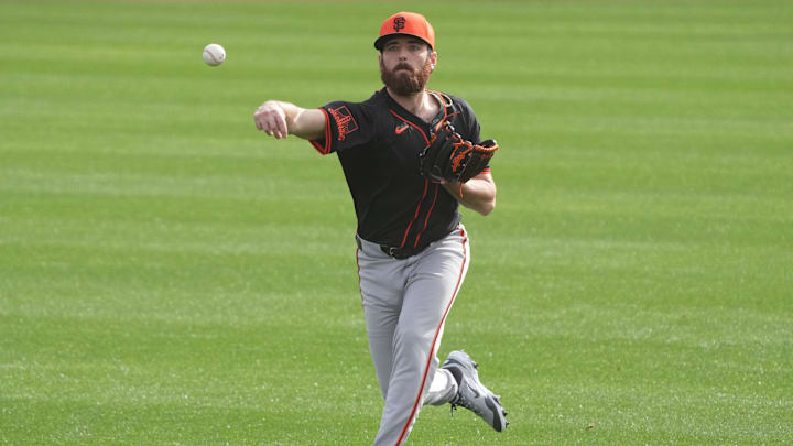 Feb 13, 2025; Scottsdale, AZ, USA; San Francisco Giants pitcher Ryan Walker (74) warms up during spring training camp. Mandatory Credit: Rick Scuteri-Imagn Images