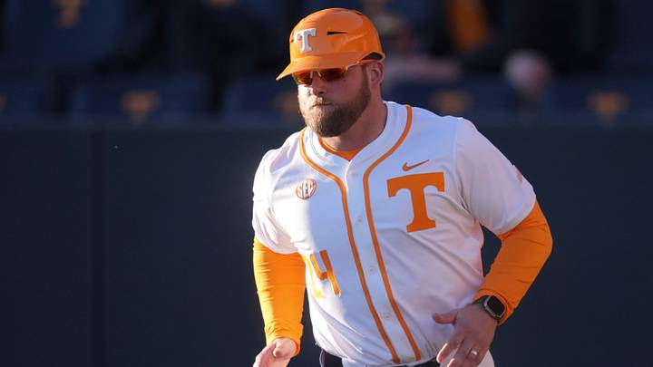 Tennessee baseball coach Josh Elander runs out to his spot at third base during the NCAA college baseball game against Nicholls on Feb. 13, 2026, in Knoxville, Tennessee.