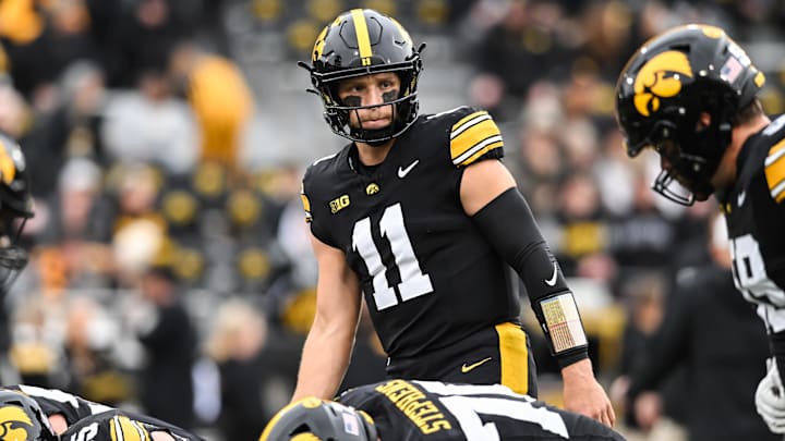 Oct 25, 2025; Iowa City, Iowa, USA; Iowa Hawkeyes quarterback Mark Gronowski (11) warms up before the game against the Minnesota Golden Gophers at Kinnick Stadium. Mandatory Credit: Jeffrey Becker-Imagn Images