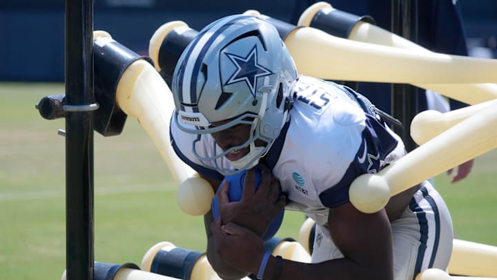 Dallas Cowboys tight end John Stephens Jr. carries the ball at training camp at the River Ridge Fields