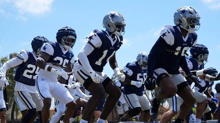 Dallas Cowboys defensive players run drills at training camp at the River Ridge Fields. 