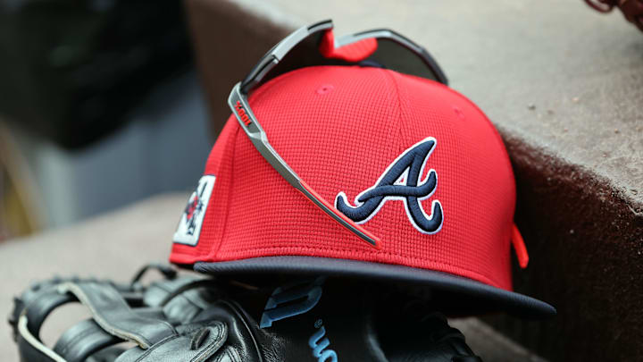 wMar 1, 2025; North Port, Florida, USA; A detail view of Atlanta Braves hat, sunglasses and glove in the dugout during the fifth inning at CoolToday Park. Mandatory Credit: Kim Klement Neitzel-Imagn Images wMar 1, 2025; North Port, Florida, USA; A detail view of Atlanta Braves hat, sunglasses and glove in the dugout during the fifth inning at CoolToday Park. Mandatory Credit: Kim Klement Neitzel-Imagn Images