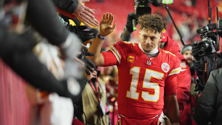 Jan 18, 2025; Kansas City, Missouri, USA; Kansas City Chiefs quarterback Patrick Mahomes (15) shakes hands with fans after defeating the Houston Texans in a 2025 AFC divisional round game at GEHA Field at Arrowhead Stadium. Mandatory Credit: Jay Biggerstaff-Imagn Images