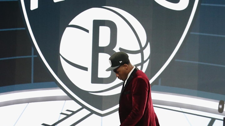 Jul 29, 2021; Brooklyn, New York, USA; Cameron Thomas (LSU) walks off the stage after being selected as the number twenty-seven overall pick by the Brooklyn Nets in the first round of the 2021 NBA Draft at Barclays Center. Mandatory Credit: Brad Penner-Imagn Images