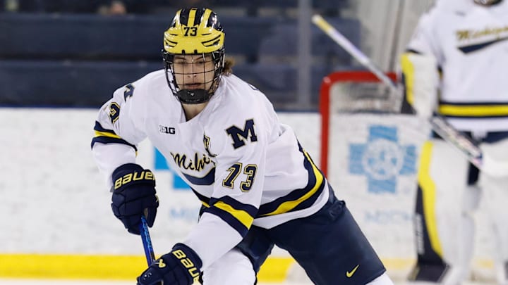 Mar 7, 2025; Ann Arbor, MI, USA;  Michigan Wolverines defenseman Ethan Edwards (73) skates with the puck against Penn State  during a Big Ten Tournament quarter final game at Yost Arena. Mandatory Credit: Rick Osentoski-Imagn Images