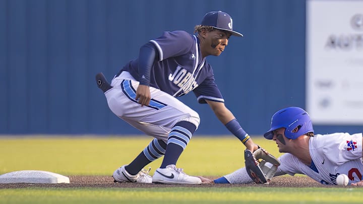 Westlake Chaparrals' Blake Peterson slides into second base ahead of the tag from SA Johnson Jaguars' Kayson Cunningham at the UIL Regional IV Final 6A baseball Round 1 playoff on June 1, 2023, at Westlake High School in West Lake Hills, TX. Westlake Chaparrals' Blake Peterson slides into second base ahead of the tag from SA Johnson Jaguars' Kayson Cunningham at the UIL Regional IV Final 6A baseball Round 1 playoff on June 1, 2023, at Westlake High School in West Lake Hills, TX.