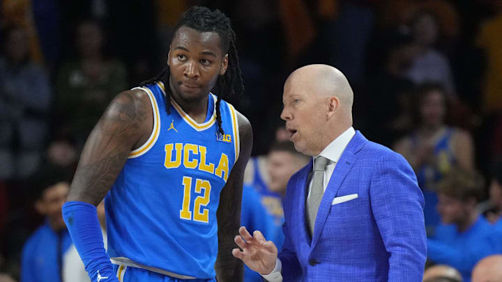 Jan 27, 2025; Los Angeles, California, USA; UCLA Bruins head coach Mick Cronin talks with guard Sebastian Mack (12) against the Southern California Trojans at the Galen Center. Mandatory Credit: Kirby Lee-Imagn Images