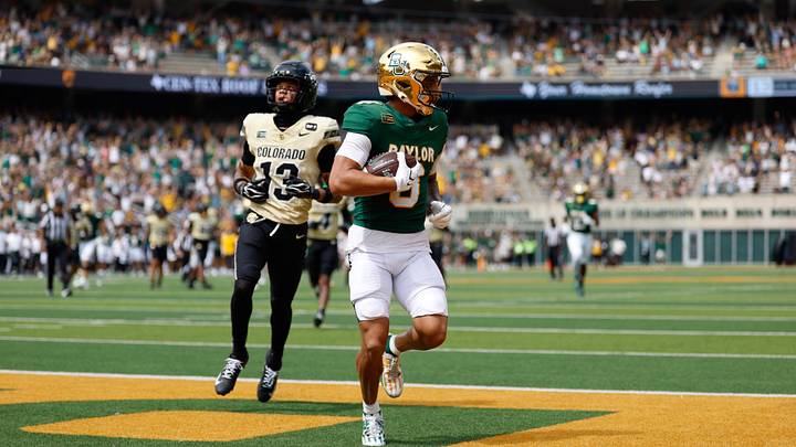 Sep 26, 2026; Waco, Texas, USA;  Baylor Bears wide receiver Jadon Porter (3) catches a touchdown pass against Colorado Buffaloes defensive back Jason Stokes Jr. (13) during the second half at McLane Stadium.  Mandatory Credit: Chris Jones-Imagn Images