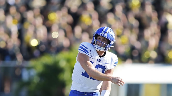 Oct 26, 2024; Orlando, Florida, USA; Brigham Young Cougars quarterback Jake Retzlaff (12) throws a pass against the Central Florida Knights in the first half at FBC Mortgage Stadium. Mandatory Credit: Russell Lansford-Imagn Images Oct 26, 2024; Orlando, Florida, USA; Brigham Young Cougars quarterback Jake Retzlaff (12) throws a pass against the Central Florida Knights in the first half at FBC Mortgage Stadium. Mandatory Credit: Russell Lansford-Imagn Images