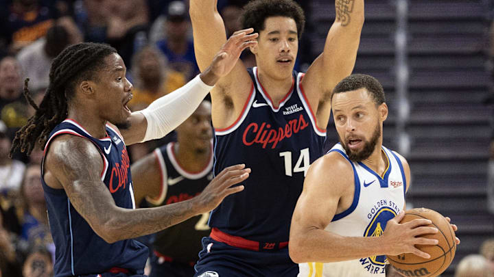Oct 17, 2025; San Francisco, California, USA; Los Angeles Clippers forward Jahmyl Telfort (19) and center Yanic Konan Niederhäuser (14) double team Golden State Warriors guard Stephen Curry (30) during the fourth quarter at Chase Center. Mandatory Credit: D. Ross Cameron-Imagn Images Oct 17, 2025; San Francisco, California, USA; Los Angeles Clippers forward Jahmyl Telfort (19) and center Yanic Konan Niederhäuser (14) double team Golden State Warriors guard Stephen Curry (30) during the fourth quarter at Chase Center. Mandatory Credit: D. Ross Cameron-Imagn Images