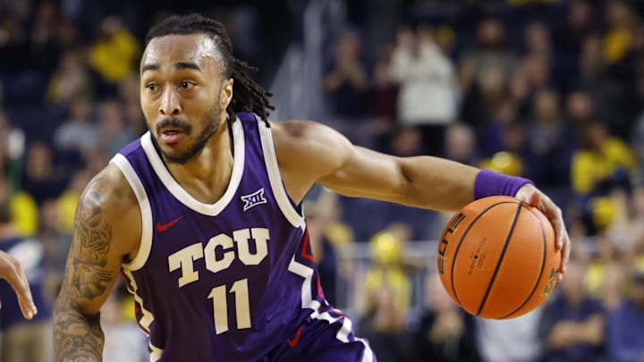 TCU Horned Frogs guard Frankie Collins (11) dribbles in the second half against the Michigan Wolverines at Crisler Center. TCU Horned Frogs guard Frankie Collins (11) dribbles in the second half against the Michigan Wolverines at Crisler Center.