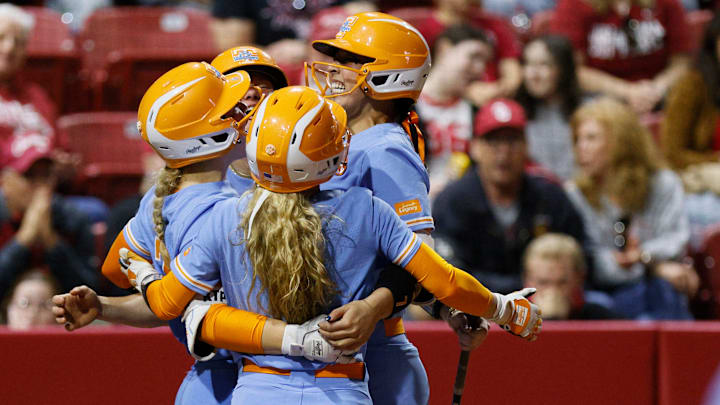 Tennessee players celebrate a two-run home run by Sophia Nugent in the eighth inning during an NCAA softball game between the Oklahoma Sooners and the Tennessee Lady Volunteers at Love's Field on Friday.