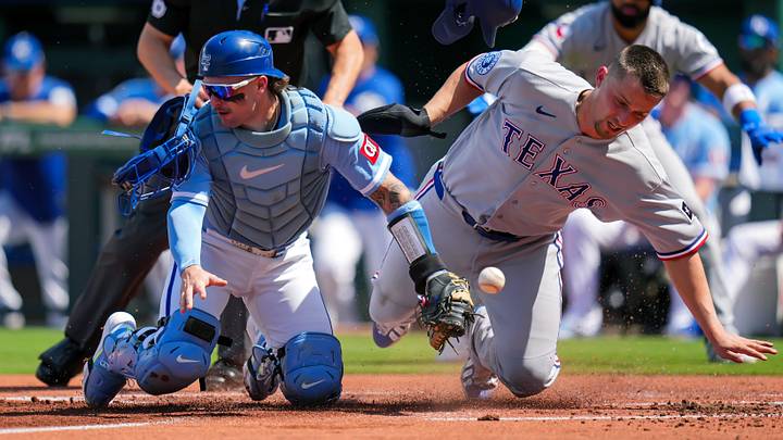 Texas Rangers shortstop Corey Seager, right, collides with Kansas City Royals catcher Carter Jensen. Texas Rangers shortstop Corey Seager, right, collides with Kansas City Royals catcher Carter Jensen.