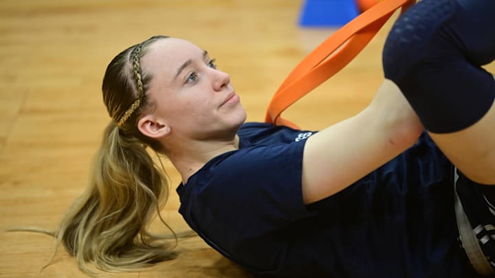 Apr 4, 2024; Cleveland, OH, USA; UConn Huskies guard Paige Bueckers (5) stretches during a practice session at Rocket Mortgage FieldHouse. Mandatory Credit: Ken Blaze-Imagn Images