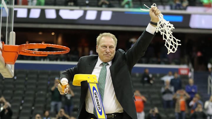 MSU coach Tom Izzo cuts down the net after of MSU's 68-67 win in the NCAA tournament East Region