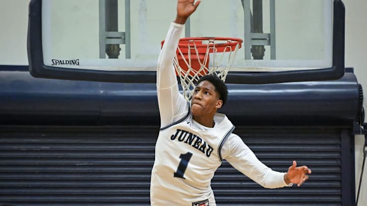 Milwaukee Juneau guard Dooney Johnson (1) elevates to block a shot against Milwaukee Hamilton in a game Friday, January 17, 2025, at MacDowell Montessori School in Milwaukee, Wisconsin.
