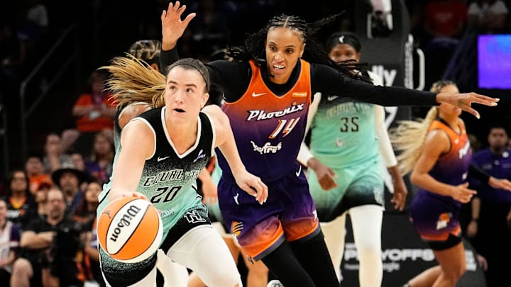New York Liberty guard Sabrina Ionescu (20) steals the ball from Phoenix Mercury forward DeWanna Bonner (14) in overtime during Game One of the 2025 WNBA Playoffs first round at PHX Arena on Sept. 14, 2025.