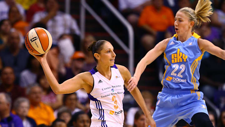 Sep 7, 2014; Phoenix, AZ, USA; Phoenix Mercury guard Diana Taurasi (3) passes the ball under pressure from Chicago Sky guard Courtney Vandersloot (22) during game one of the WNBA Finals at US Airways Center. The Mercury defeated the Sky 83-62. Mandatory Credit: Mark J. Rebilas-Imagn Images
